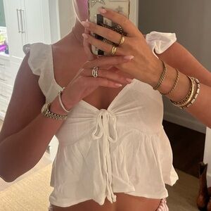 White blouse with frilly sleeves and tie